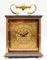 Luxor, a contemporary brass mantle clock, the brass dial with black Roman numerals and scroll