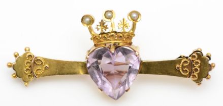 A Victorian 9ct gold heart shaped amethyst bar brooch, the amethyst mounted with a seed pearl set