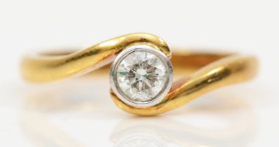 An 18ct gold single stone brilliant cut diamond ring, the collet set diamond stated weight 0.32ct,