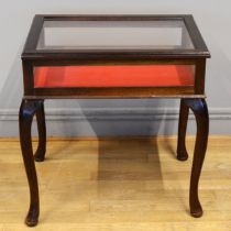 An early 20th century mahogany framed bijouterie table raised on cabriole supports terminating in