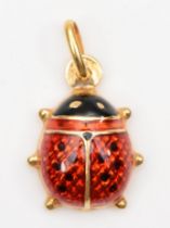 A 9ct gold and enamel ladybird charm, 17mm, 1.1gm.