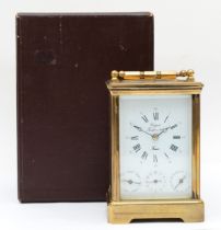An early 20th century Rapport brass corniche cased and four glass repeating striking carriage clock,
