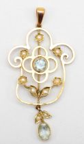 An Edwardian 9ct gold aquamarine and seed pearl openwork pendant, 23 x 45mm, 2.1gm.