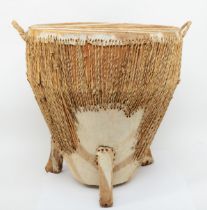 A contemporary African floor standing twin handled African drum covered with leopard skin and