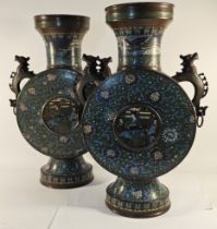 A pair of early 20th century Chinese bronze and enamel moon vases, with elephant handles, 54cm