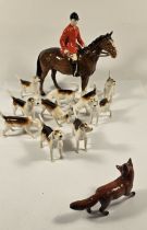 Beswick huntsman on horse figurine, together with ten hunting hounds and a fox,