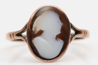 A Victorian carved sardonyx cameo ring in copper mount, stamped 9ct, P - Q.