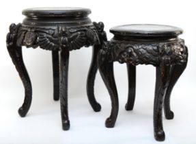 Two 20th century carved Chinese hardwood stands, the tops each incised with Greek Key pattern,