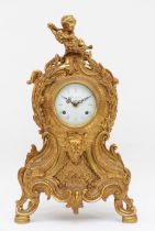 Imperial, a 20th century gilt brass cartouche shaped mantle clock, cast with putti finial and