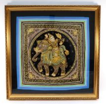 A 20th century Indian stump and beadwork panel, embroidered with a Goddess riding an elephant,