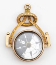 A Victorian unmarked gold swivel watch fob, set with a compass and blood stone, 34 x 25mm, 8.7gm.