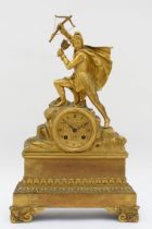 A 19th century French parcel gilt mantle clock, surmounted with a male hunter with bow and arrows,