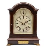 A 20th century Georgian style mahogany cased 8 day mantle clock, the brushed silvered dial with
