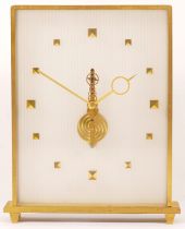 Jaeger le-Coutre, a mid 20th century brass and glass cased mantle clock, the dial with applied
