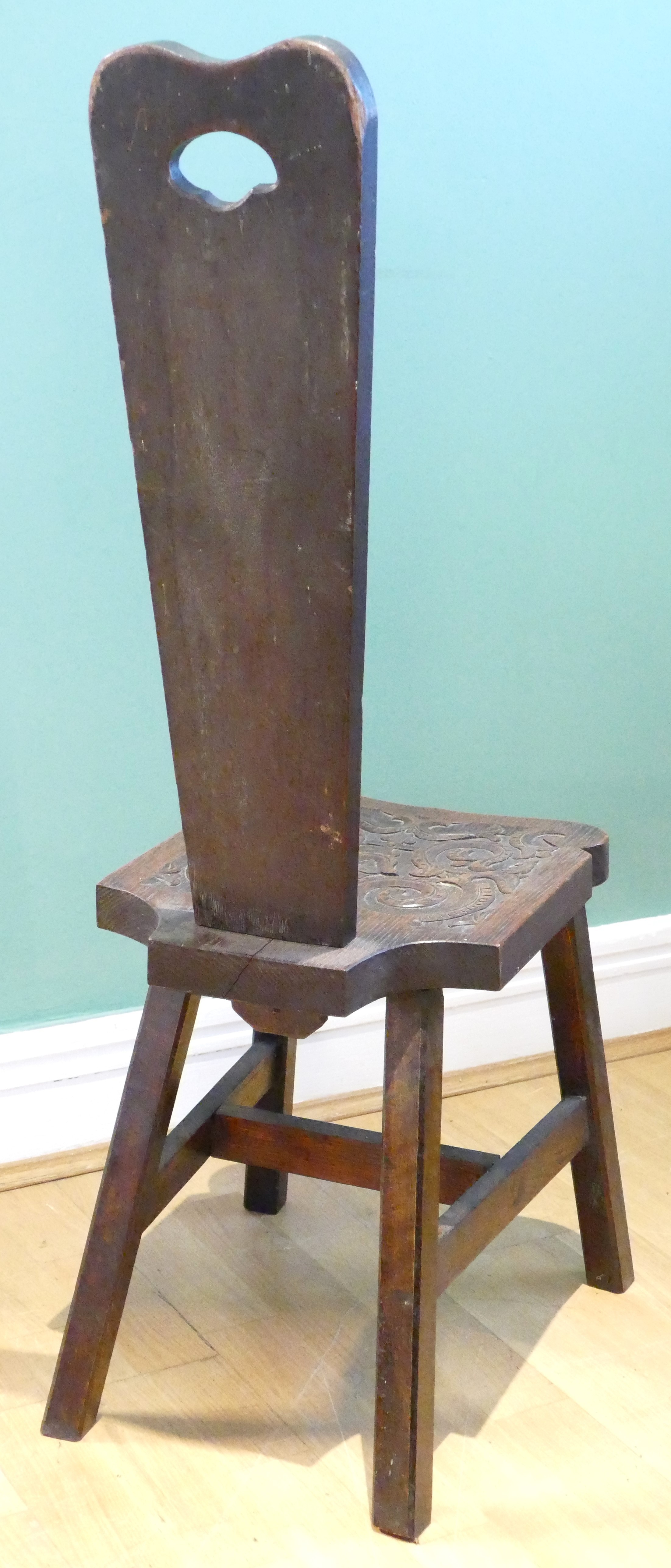 A late 19th century Welsh carved oak spinning chair, having carved floral decoration, raised on - Image 7 of 8