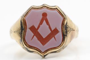 Masonic interest; A Victorian gold Masonic signet ring with carved square and compass in sardonyx