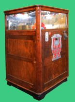 A Rotary Merchandiser, by Exhibit Supply Co. Chicago, c.1930, serial number 5481, varnished wood