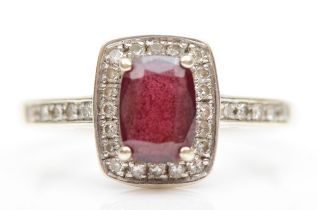 A 9ct white gold almandine garnet and eight cut diamond cluster ring, M, 2.2gm.