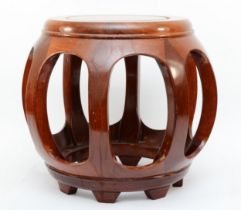 A 20th century Chinese circular topped hardwood stand, with pierced sides, 35cm high.