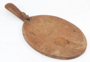 Robert 'Mouseman' Thompson of Kilburn, a mid 20th century oval shaped cheeseboard, with carved mouse