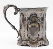 A Victorian Gothic revival silver christening mug, by George Angell & Co, London 1858, with embossed