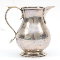 A George III silver sparrow beak cream jug, by Richard Bayley (probably), London 1738, on circular