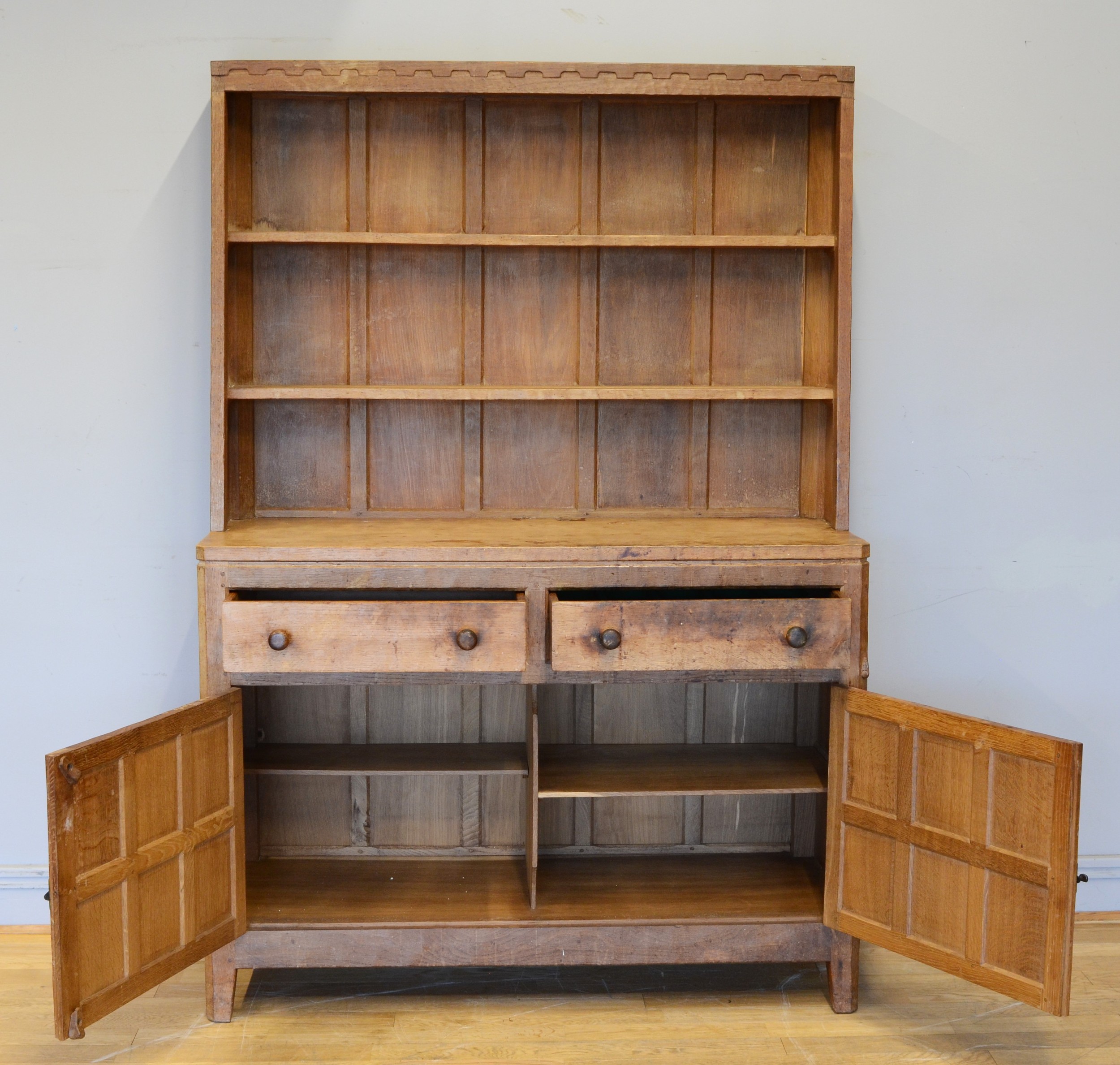 Peter 'Rabbitman' Heap, a mid 20th century adzed oak Welsh style dresser, the panelled upper section - Image 2 of 4