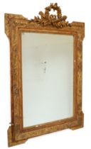 A 19th century gilt painted hanging bevel edged wall mirror, with carved laurel wreath and