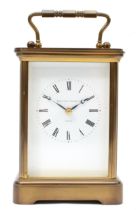 Matthew Norman of London, a 20th century brass corniche and four bevelled glass carriage clock, with