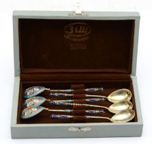 A Russian set of six early 20th century silver gilt champlevé enamel coffee spoons, by Sergey