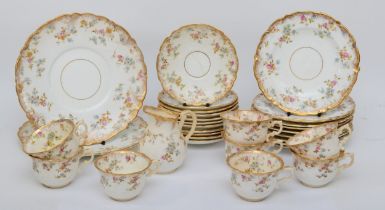 A 19th century gilt and hand painted floral teaset comprising of ten 10cm saucers, eight cups,