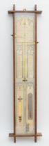 A 19th/early 20th century oak cross framed Admiral Fitzroy wall hanging barometer, with printed