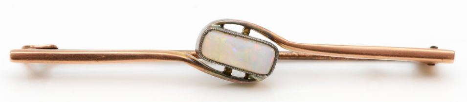 An early 20th century rose gold opal bar brooch, 5.5cm, 2.8gm.