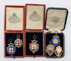 Football interest; two early 20th century silver and enameled York crested Faber cup medals,