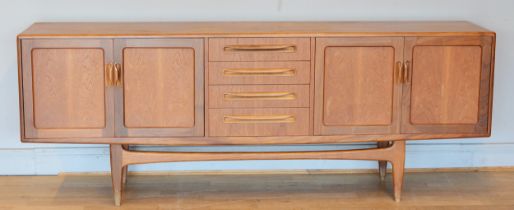 Victor Wilkins for G-Plan, a mid 20th century teak sideboard with four central drawers flanked by