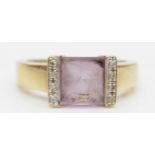A 9ct gold princess cut amethyst dress ring, the amethyst flanked by diamonds, P, 3.8gm.