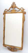 A 19th century Robert Adam gilt framed hanging wall mirror, the cornice with swag and urn