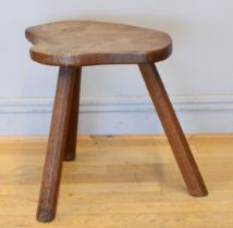 Robert 'Mouseman' Thompson of Kilburn, a 20th century slightly adzed carved oak stool, with shaped