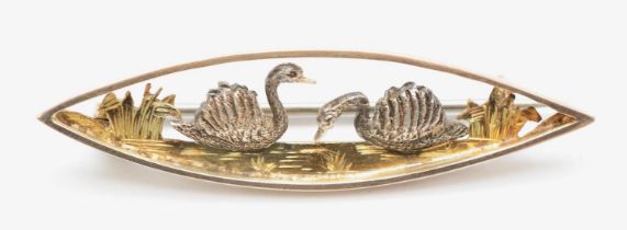 A Victorian 9ct gold navette shaped brooch decorated with two white gold swans, 4 x 1.1 cm, 3gm.