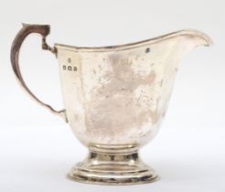 A George VI silver cream jug, by William Neale & Son Ltd, Birmingham 1937, with canted corners and