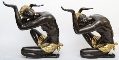 A pair of cast metal blackamoor table supports, cast in the form of kneeling men a with hands up,