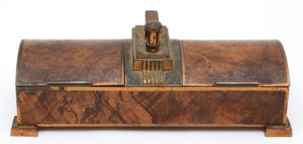 Ronson, an Art Deco gilt metal walnut effect twin section dome topped table lighter, raised on