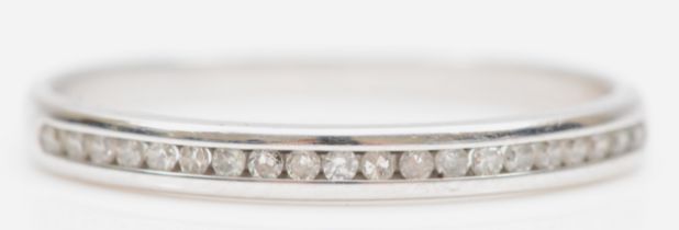 A 9ct white gold channel set brilliant cut diamond half eternity ring, P, 1.3gm.