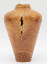 Paul Boak (Contemporary), a turned walnut vase baluster shaped vase, signed to base, 20.5cm high.