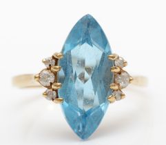 A 9ct gold marquise cut blue topaz and brilliant cut diamond cocktail ring, R, 3.8gm.
