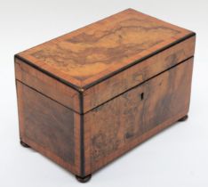 A 19th century burr walnut veneered twin division tea caddy, the hinged lid opening to reveal twin