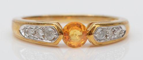 A 9ct gold yellow sapphire dress ring, with diamonds set to the shoulders, N-O, 2.6gm.