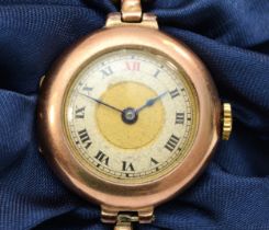 A 9ct gold cased ladies wrist watch on expandable bracelet, London 1919, the mechanism inscribed