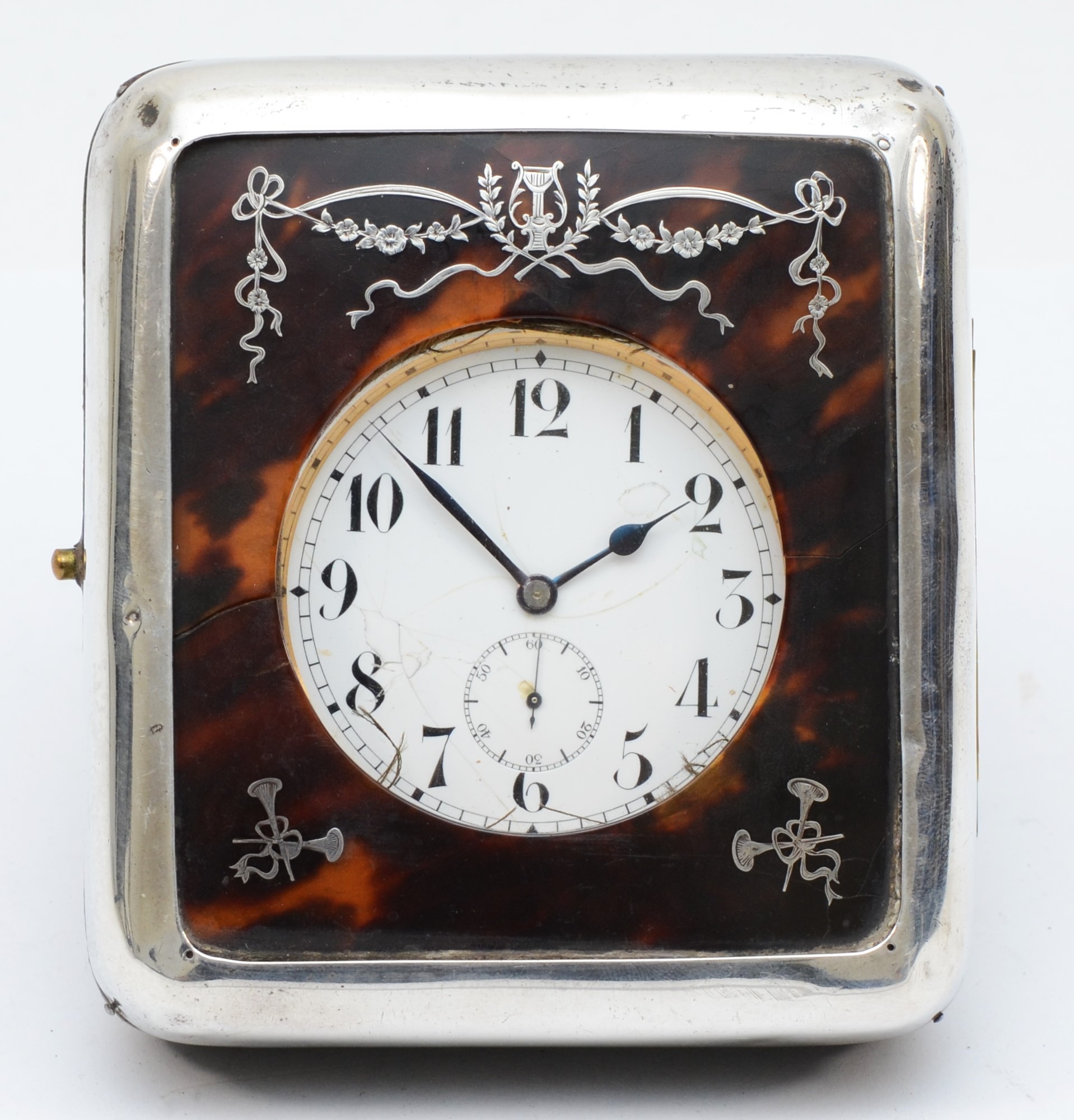 A silver and tortoiseshell boudoir easel clock, London 1918, opening to reveal a nickel plated