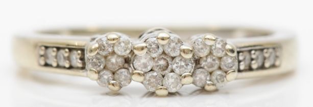 A 9ct white gold brilliant cut diamond cluster ring, O, 2.1gm.